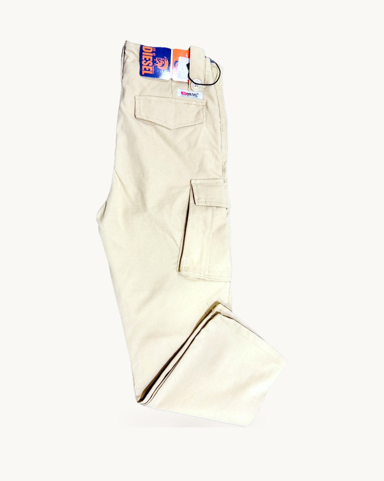 Beige cotton box pants, folded flat