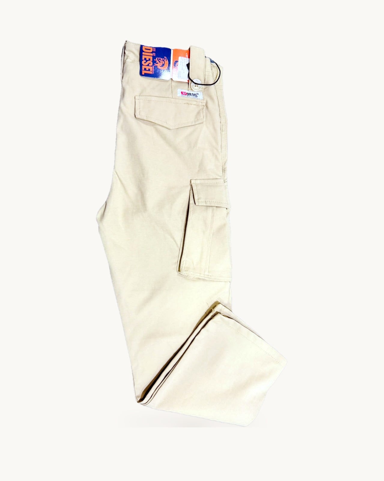 Beige cotton box pants, folded flat
